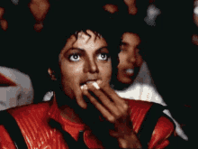 Black man eating popcorn GIF Michael Jackson Thriller